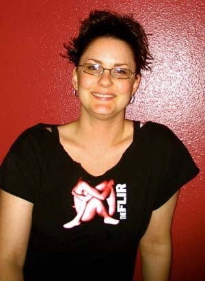 Someone wearing the Human Heart shirt, standing against a red wall
